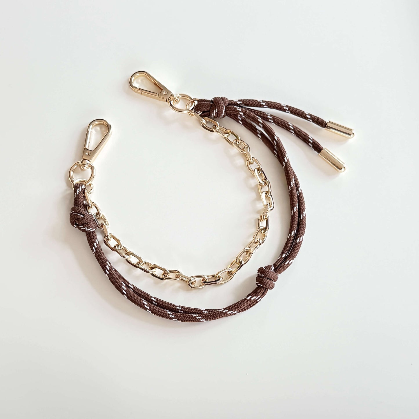 Bag charm with cord and chain in brown