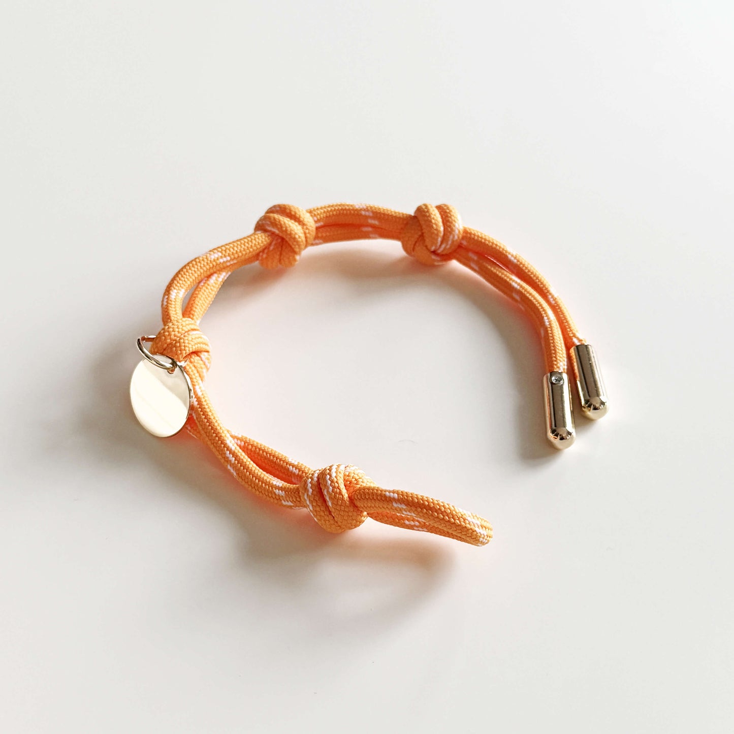 Apo cord bracelet in orange
