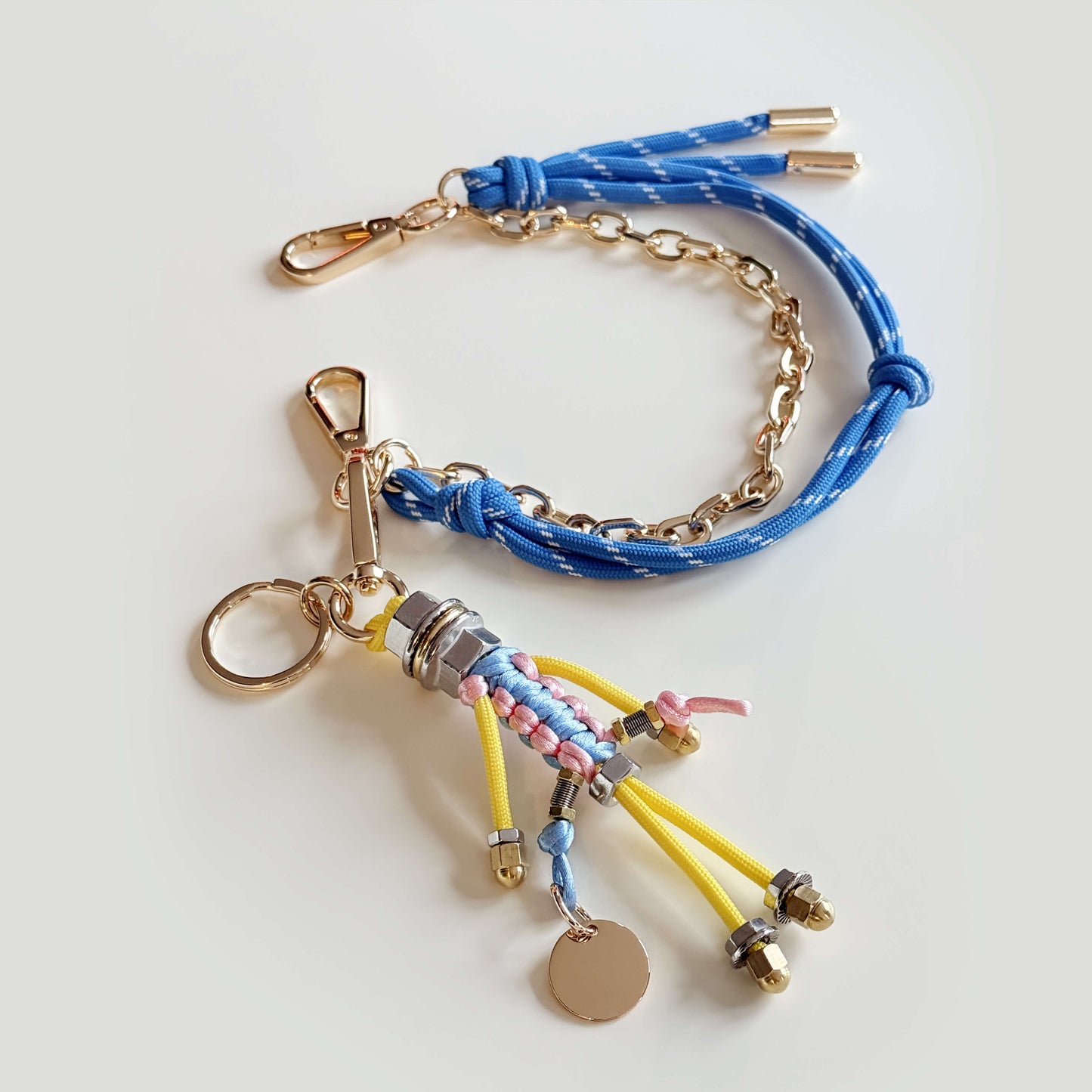 Bag charm with cord and chain in blue