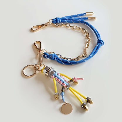 Bag charm with cord and chain in blue