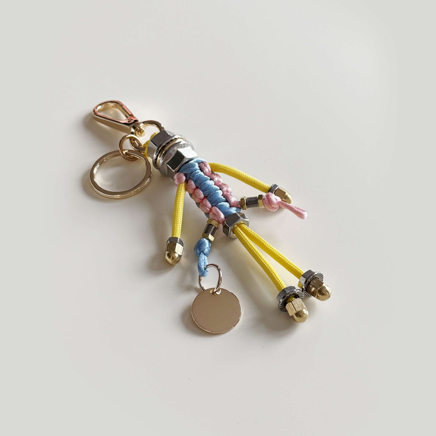 Bag charm with cord and chain in blue