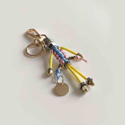 Bag charm with cord and chain in blue