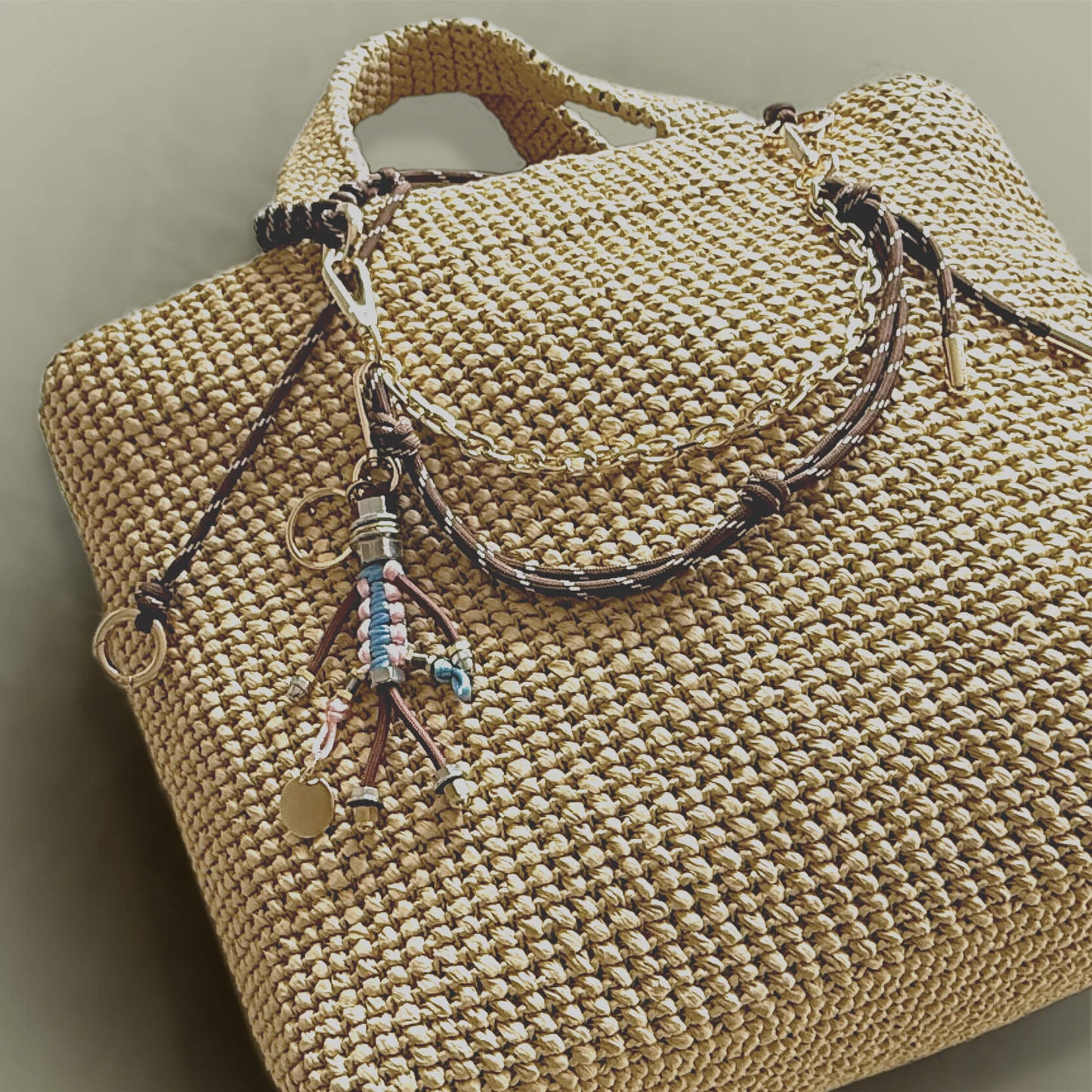 Bag charm with cord and chain in blue