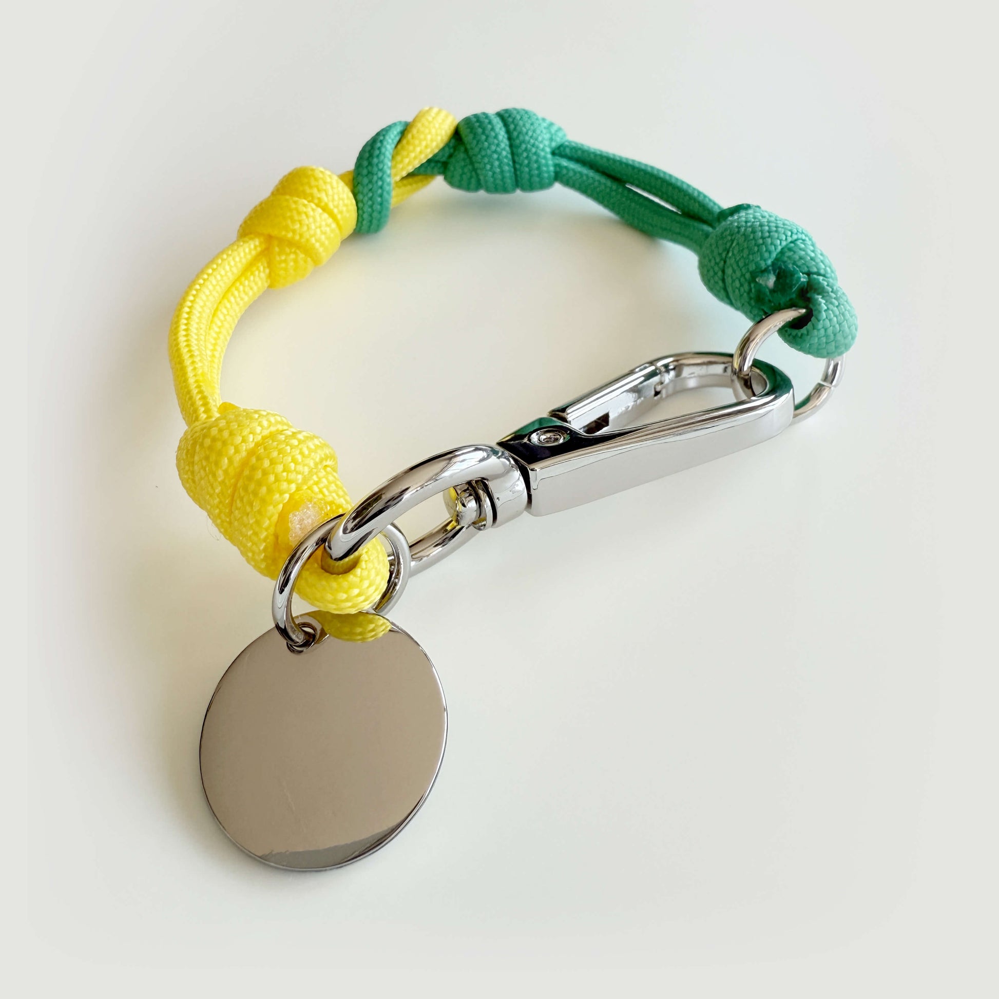 Mapo cord bracelet in beach color, durable nylon, metal clasp, adventure-inspired design.