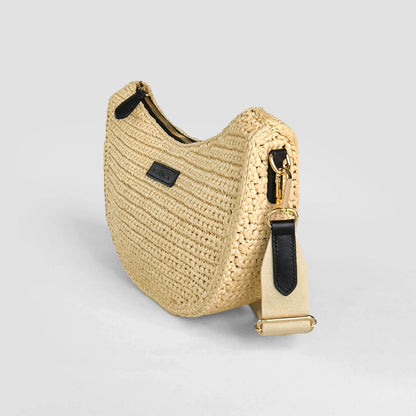 Beige woven handbag with black zipper on a light gray background